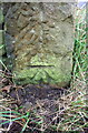 Benchmark on gatepost beside cattle grid on south side Hob Cote Lane