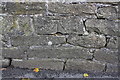 Benchmark on wall fronting No. 261 Oakworth Road