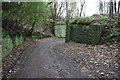 Damens Lane at bend at remains of bridge of dismantled railway