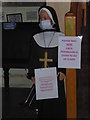 Masked nun in the gatehouse at Minster Abbey