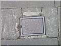 Dateman Amoores manhole cover on Argyll Street, Llandudno