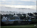 Early morning mist over housing estate