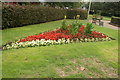 View of a flowerbed in Leyton Orient colours in Coronation Gardens