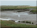 TF7244 : The landward end of Thornham harbour channel by Christine Johnstone