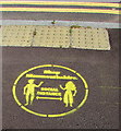 Yellow Social Distancing reminder on the Goldwire Lane pavement, Monmouth