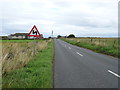 NK0462 : Approaching bends on the B9033 towards St Combs by JThomas