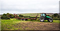 NZ0150 : Tractor with low trailer by Trevor Littlewood