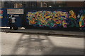 TQ3182 : View of a mural on a construction hoarding on Goswell Road #2 by Robert Lamb