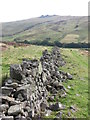 NT9422 : Dilapidated Drystone Wall, Blackseat Hill by Geoff Holland