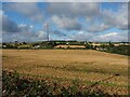 Field of stubble below the Emley Moor transmitting station