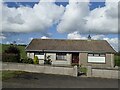 Bungalow east of the Ballydonell Road junction on the A25