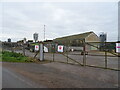 Uninviting entrance to farm buildings near Coldstone House Farm