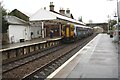 Class 156 number 156513 stops at Annan Station on its way to Carlisle