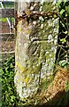 Benchmark on gatepost on north side of road under Hawber Hill