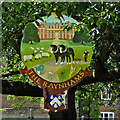 The Raynhams village sign