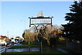 TG2916 : Wroxham village sign by Adrian S Pye