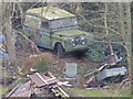 Old Landy in the woods at the top of a rural garden at Hook-a-gate