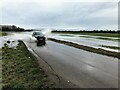 TF4411 : Driving through flood water on Parson Drove Lane near Leverington by Richard Humphrey