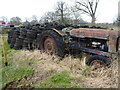 Old Fordson Major tractor abandoned at Sundorne Farm alongside a tyre pile