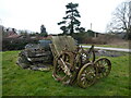 Ancient wagon components piled beside the path at Sundorne Farm