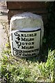 NY3552 : Old milestone on NW side of A595 at Orton Grange by Luke Shaw