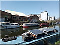 View of boats and graffiti on the River Lea