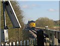 Short double ended train leaving Glebe Road level crossing