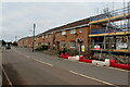 Brick houses beyond a building site in Llanharry