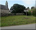 Signpost on grass near St Illtyd