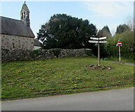 ST0080 : Signpost on grass near St Illtyd's Church, Llanharry by Jaggery