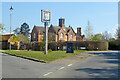 Lilley - village sign and former estate cottages