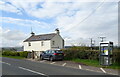 NY6818 : House and phonebox on the B6260, Burrells by JThomas