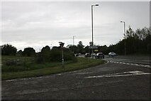 TL2027 : Ashbrook Lane at the junction of the A602 by David Howard