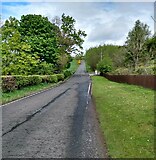 NS9771 : Aiket Road heading up Bathgate Hills by Jim Smillie