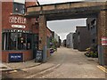 New houses through an old factory gate