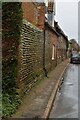 TF9441 : Flint wall and row of cottages, Warham by N Chadwick