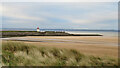 View over the dunes to Burry Port breakwater and lighthouse