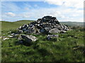 NT7703 : Cairn, Byrness Hill by Geoff Holland