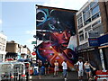 View of a mural on the side of Shillings off licence on Anerley Road