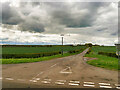 NZ1797 : Minor Road joining the A1 near Eshott Airfield by David Dixon