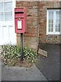 Benchmark by a post box