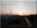 TQ5282 : View of the sunset from the footbridge of Rainham Station by Robert Lamb