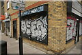 View of shutter art on a block of flats on the corner of Barnet Grove and Bethnal Green Road