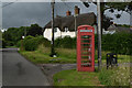 SU2228 : Telephone box book exchange by the green at East Grimstead by David Martin