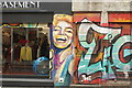 View of Marilyn Monroe street art on the side of Vintage Basement on Cheshire Street