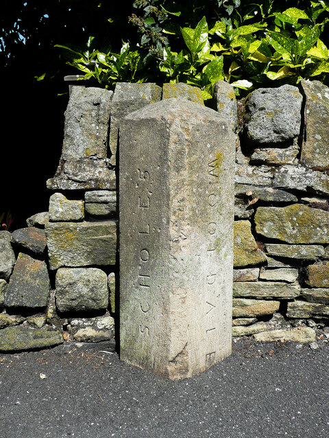 Boundary Stone, White Wells Road, Scholes This stone is one of a series around the perimeter of Scholes Local Board. It is rather unexpected in this position within Scholes village, but there were a number of detached parts of the Wooldale township within Scholes. See also &lt;a href=&quot;https://www.geograph.org.uk/photo/6904711&quot;&gt;SE1507 : Boundary stone, White Wells Road, Scholes&lt;/a&gt; for context.
