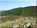 NT0833 : Fenceline and track above Knowe Kniffling by Alan O'Dowd