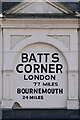 SU3613 : Distance sign above shopfront at Batts Corner by David Martin