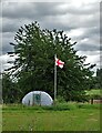 Polytunnel and national flag in North Clifton