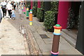 View of brightly painted bollards on Floral Street #2